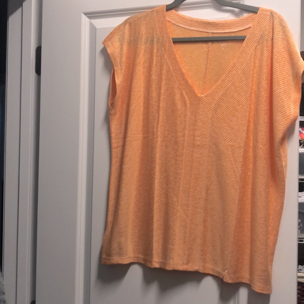 V neck thinner orange with white stripe shirt.